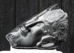 Ann Wadman  - Head in black serpentine stone on marble stone  